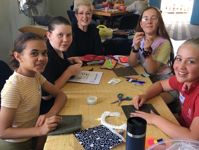 Payton Tass, Havarna Parry, Elessa Sales and Imogen Tennant stitch and chat with Mackay councillor Fran Mann (middle). Picture: Contributed