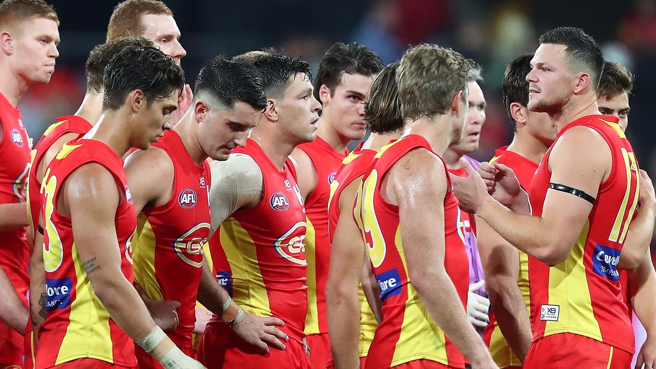 Paul Roos has called on the AFL to act to stop player agents blocking moves to the Suns.