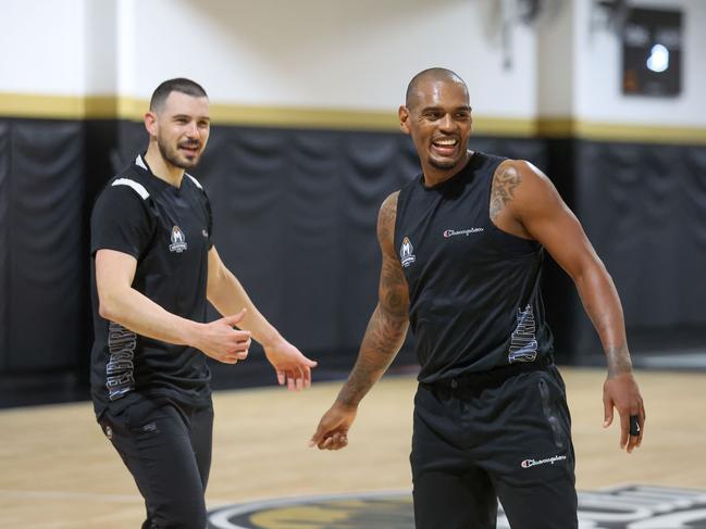 United captain Chris Goulding and Rathan-Mayes share a smile. Picture: Brendan Beckett