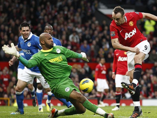 Ali Al-Habsi denies Manchester United’s Dimitar Berbatov in 2011.