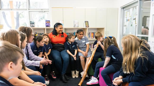 Reservoir East Primary School principal James Cumming and staff member Nikki Penrith with Indigenous students of the school.