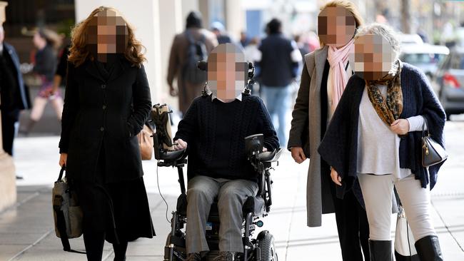 The man charged with attempted murder arrives at court with supporters before his trial. Picture: Mark Brake/AAP