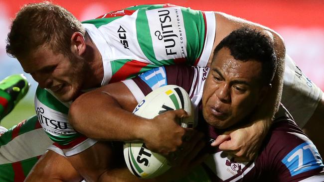 Manly's Siosaia Vave tackled by Rabbitohs prop Thomas Burgess. Picture Gregg Porteous.