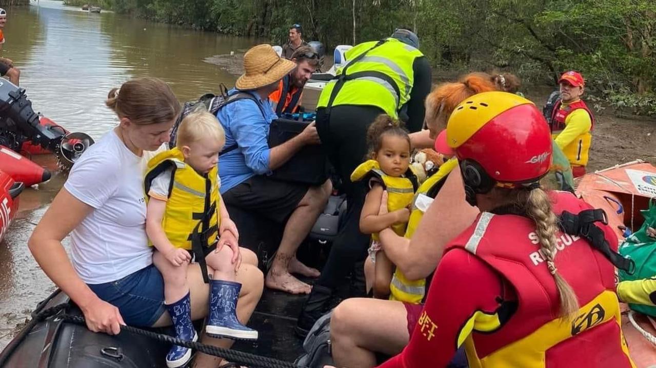 Penny Fenner and her two-year-old daughter Malia were rescued by surf life savers as rapidly rising flood water entered their Holloways Beach home as the Barron River flooded in December. Picture: Supplied.