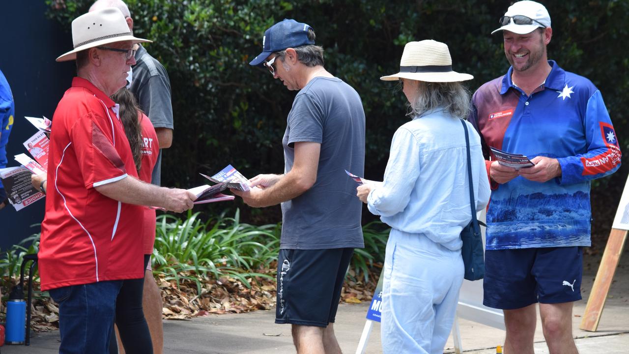 Mundingburra candidates Les Walker, Janelle Poole and Michael Pugh meet with early voters. Photo: Daniel Shirkie.