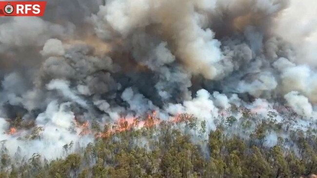 The intense heat from the blaze caused a thunderstorm. Picture: RFS