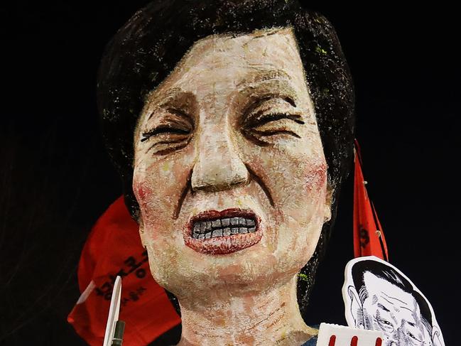 SEOUL, SOUTH KOREA - DECEMBER 03: Protesters gather and occupy major streets in the city center for a rally against South Korean President Park Geun-hye on December 3, 2016 in Seoul, South Korea. Park addressed to the nation this week that she would leave it to the Parliament to decide if she should step down from her presidency after her friend Choi Soon-sil was charged with corrupt influence over state affairs. (Photo by Chung Sung-Jun/Getty Images)