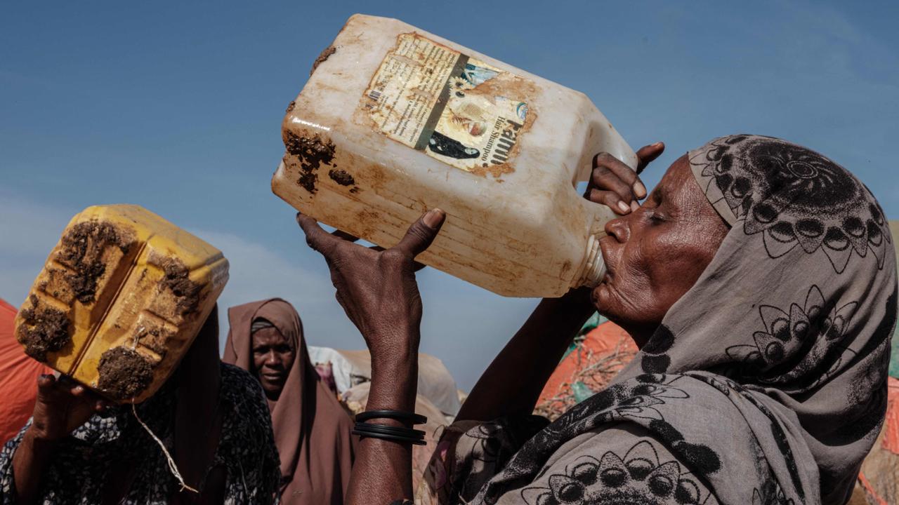 Hawa Mohamed Isack, 60, drinks water at a water distribution point at Muuri camp, one of the 500 camps for internally displaced persons in Baidoa, Somalia. Picture: Yasuyoshi Chiba/AFP