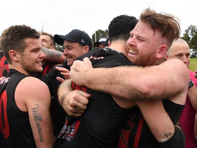 Ecstatic Redback Luke O'Brien (right) joined his father, club great Mick, as a senior premiership player.