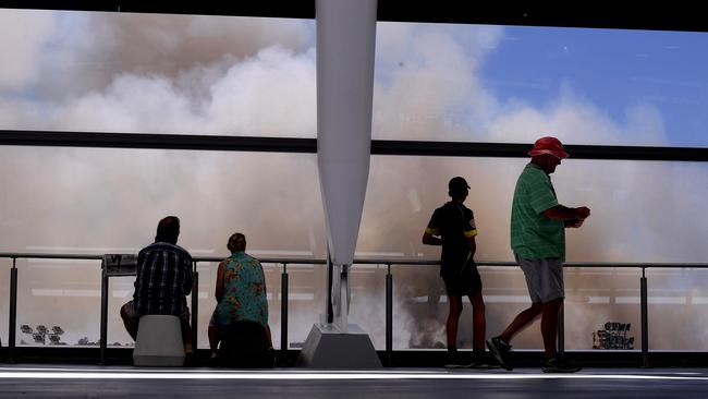 Spectators view the bushfire from Perth Stadium. Picture: AAP