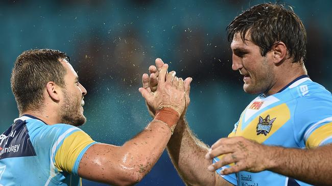 GOLD COAST, AUSTRALIA - MARCH 22: Aidan Sezer of the Titans celebrates scoring a try with Dave Taylor (R) during the round three NRL match between the Gold Coast Titans and the Newcastle Knights at Cbus Super Stadium on March 22, 2015 on the Gold Coast, Australia. (Photo by Matt Roberts/Getty Images)