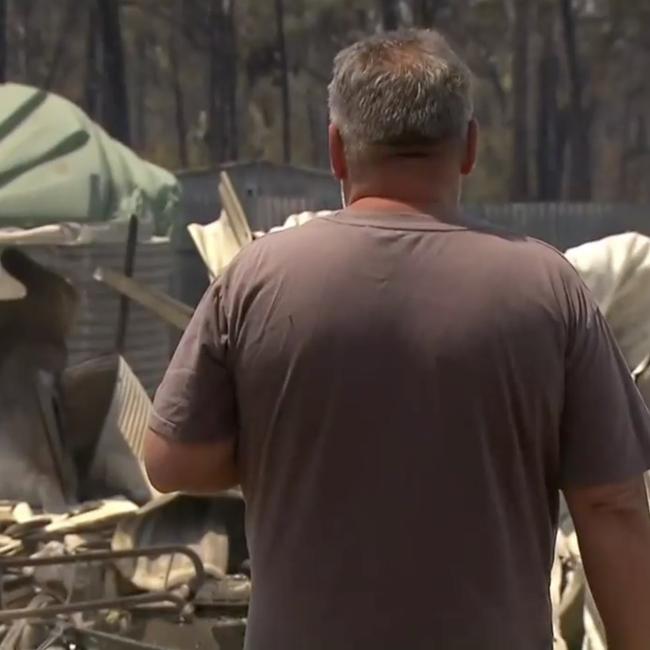 Jason, partner of Tayla McKenzie, surveys the devastation at their property in Tara after the fires. Photo: 7 News
