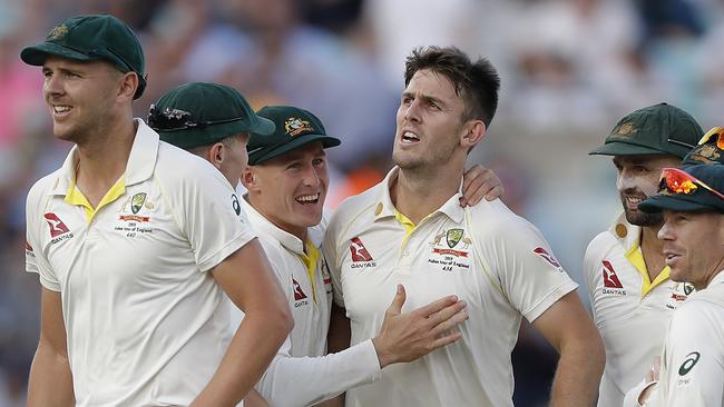 Mitch Marsh celebrates after taking the wicket of Chris Woakes. Picture: Ryan Pierse/Getty Images