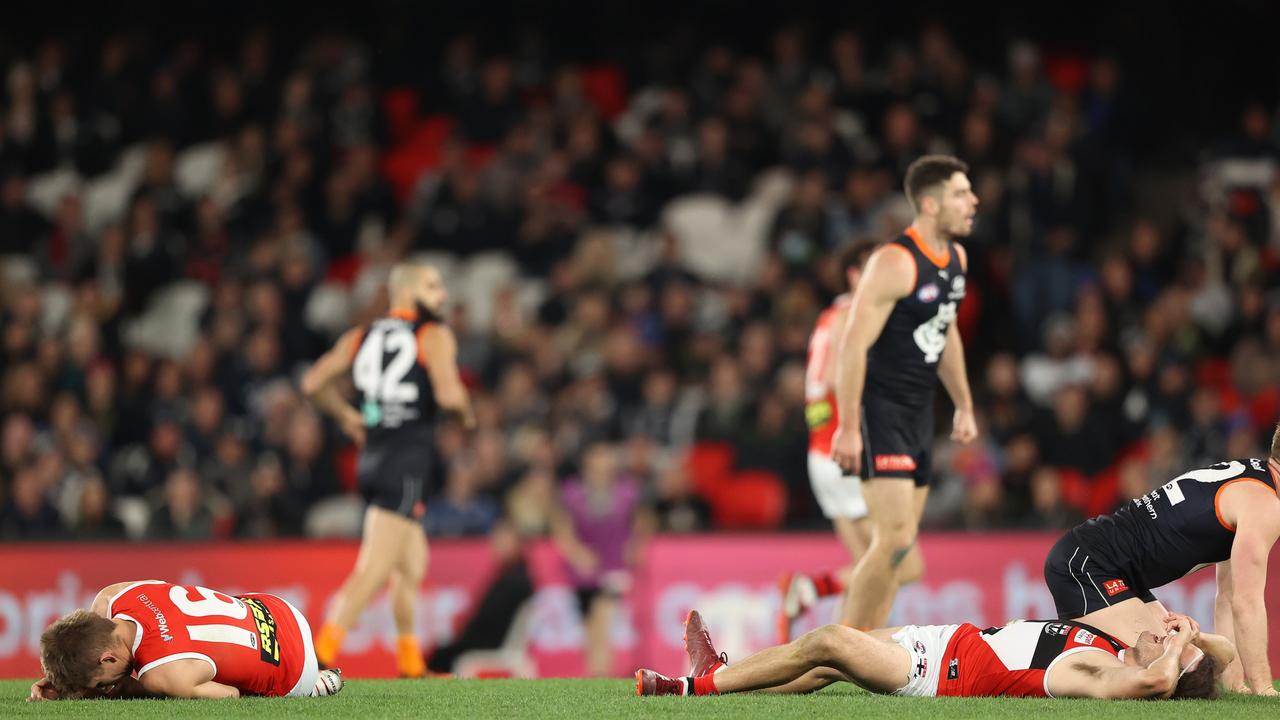 Butler and Clark lie on the ground dazed after the heavy impact. Picture: Robert Cianflone/Getty Images