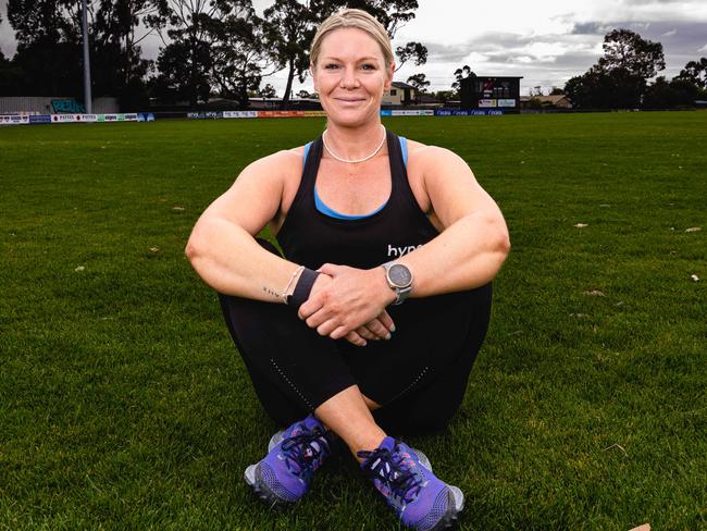 Lou Calvert is raising money for her boyfriend Ryan Wiggins, by attempting to beat her own world record for the most chest-to-ground burpees in 24 hours. Picture: Linda Higginson