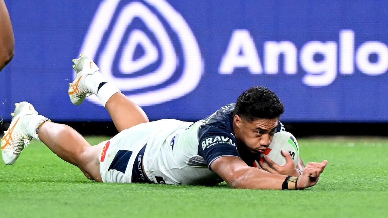 Murray Taulagi scores a try against the Dolphins. (Photo by Bradley Kanaris/Getty Images)