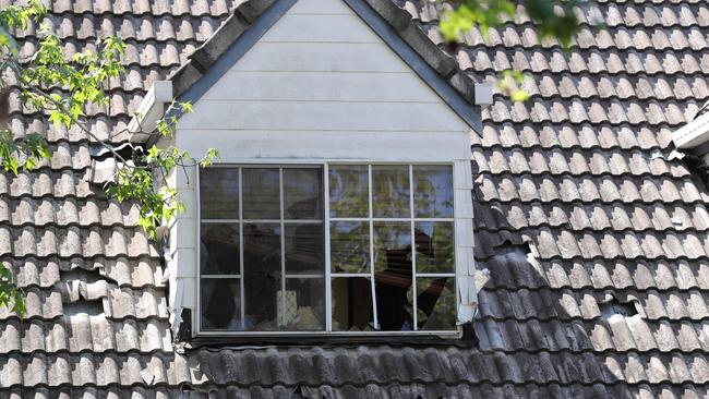 Smashed windows at the once prestigious mansion that Logan City Council bought but left to rack and ruin. Picture: AAP/Jono Searle