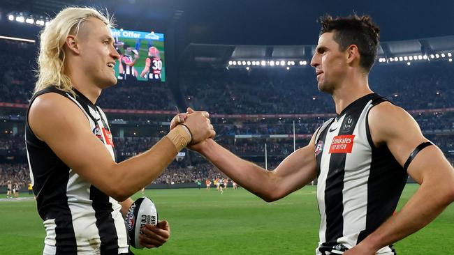 MELBOURNE, AUSTRALIA - SEPTEMBER 22: Darcy Moore and Scott Pendlebury of the Magpies celebrate during the 2023 AFL First Preliminary Final match between the Collingwood Magpies and the GWS GIANTS at Melbourne Cricket Ground on September 22, 2023 in Melbourne, Australia. (Photo by Dylan Burns/AFL Photos via Getty Images)