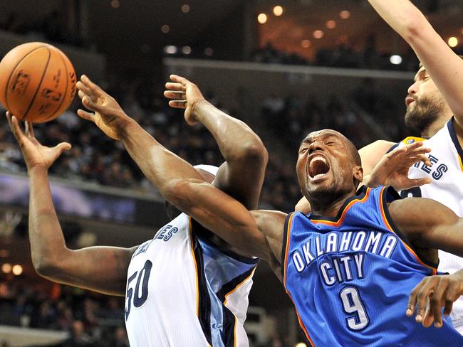 Memphis Grizzlies forward Zach Randolph (50), Oklahoma City Thunder forward Serge Ibaka (9) and Grizzlies centre Marc Gasol battle under the basket.