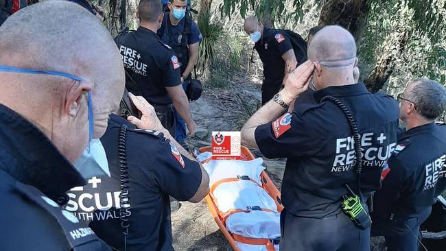 NSW Fire and Rescue officers had to take turns carrying the stretcher along the narrow bushland track. Picture: NSW Fire and Rescue (Forestville)