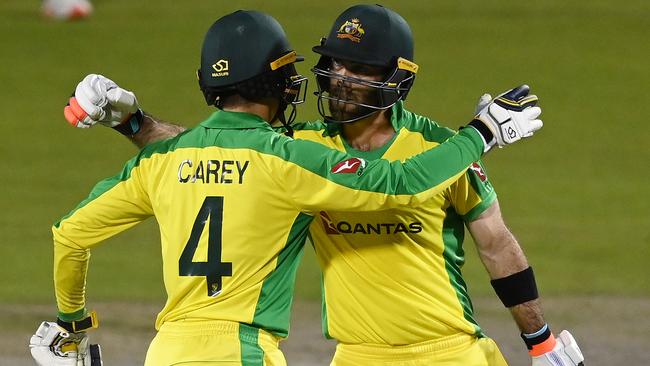 Glenn Maxwell celebrates with Alex Carey after reaching his century. Picture: Getty Images