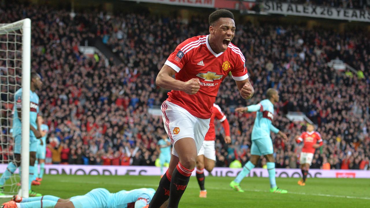 Manchester United's French striker Anthony Martial celebrates after scoring their first goal during the English FA Cup quarter final football match between Manchester United and West Ham United at Old Trafford in Manchester, north west England, on March 13, 2016. The game finished 1-1. / AFP PHOTO / PAUL ELLIS / RESTRICTED TO EDITORIAL USE. No use with unauthorized audio, video, data, fixture lists, club/league logos or 'live' services. Online in-match use limited to 75 images, no video emulation. No use in betting, games or single club/league/player publications. /