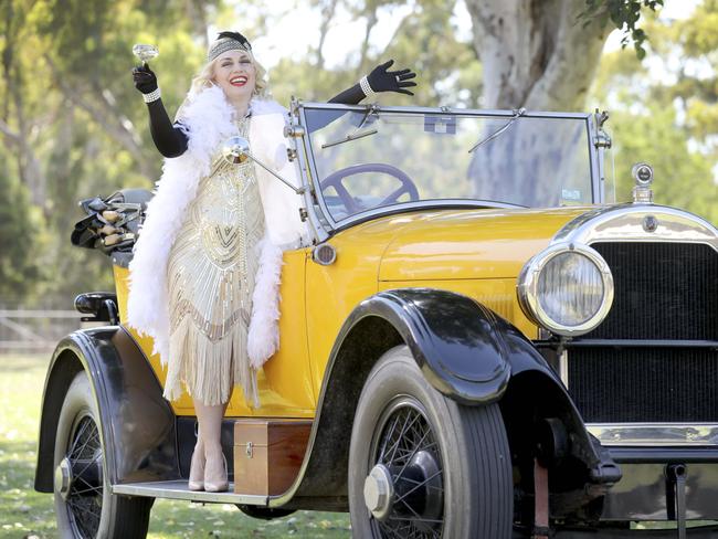 Performer Dolly Lee - dressed by Adelaide Costume Shop - with a 1925 Cadillac V63 at Birdwood Motor Museum. The Adelaide Costume Shop in Wright St has 1920s outfits for sale and hire - open until 5pm today. Picture: Dean Martin / AAP