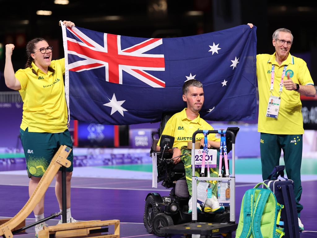 Daniel Michel, pictured with his support team after winning the silver medal in the boccia final, and Jamieson Leeson together delivered Australia its first multiple boccia medals at a Paralympic Games. Picture: Michael Reaves/Getty Images