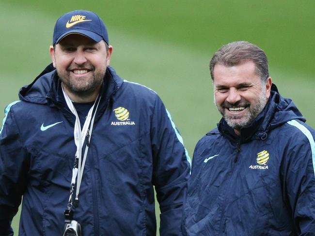 Peter Cklamovski, left, watches on alongside mentor Ange Postecoglou during their time with the Socceroos. Picture: Getty Images