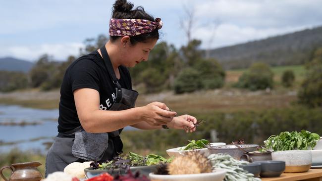 Chef Analiese Gregory adds finishing touches to her dishes during the big cook at Dunalley. Picture: NATIONAL GEOGRAPHIC/JUSTIN MANDEL