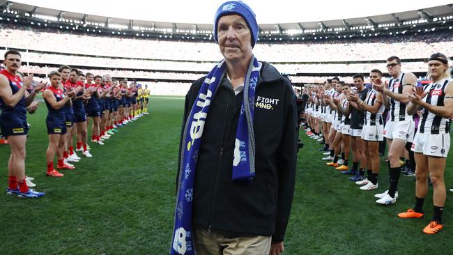 Neale Daniher walks through a guard of honour before the round 13 AFL match between Melbourne and Collingwood at the MCG on June 12. Picture: Michael Klein.