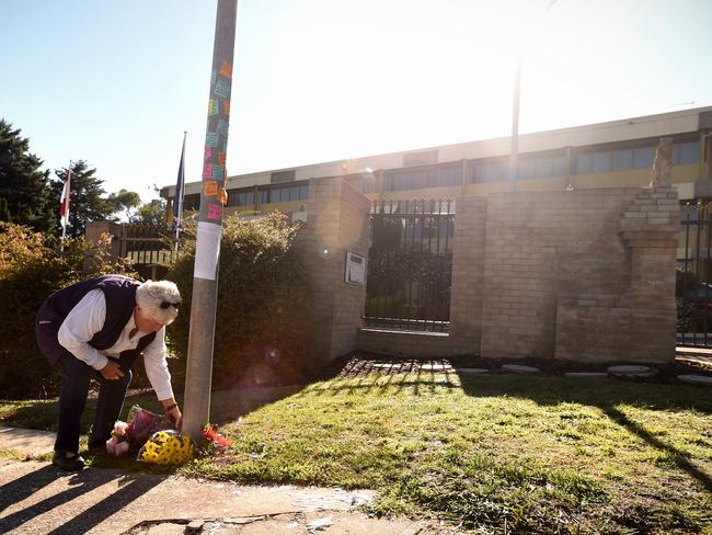 Paying respects ... A woman places flowers outside the Indonesian Embassy in Canberra. Picture: AAP/Lukas Coch