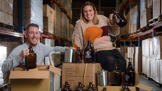 ‘Brand Hustle’ team Heath and Melissa Shirtcliffe are supplying growlers to help pubs beat hard lockdown and legally sell takeaway tap beer. Picture: Jason Edwards