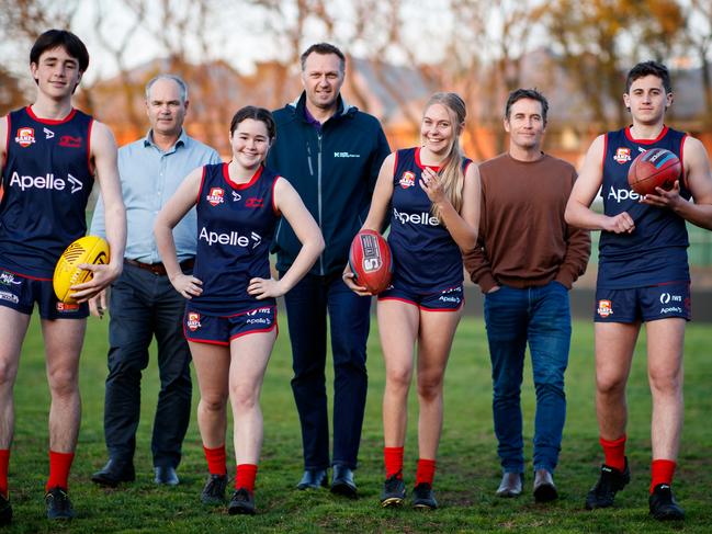 Norwood greats with their 15 year old children, Richard Kelly with twins Jim and Annabel, Matt Robran with daughter Aleesha and Brett James with son Archie at Norwood Oval. Picture Matt Turner.