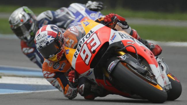 Marc Marquez, of Spain, leads Jorge Lorenzo, of Spain, on his way to winning the Indianapolis Moto GP motorcycle race at the Indianapolis Motor Speedway in Indianapolis, Sunday, Aug. 10, 2014. (AP Photo/Michael Conroy)