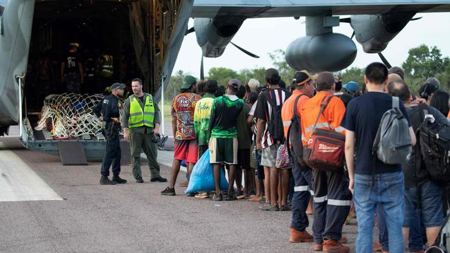 A Royal Australian Air Force C-27J Spartan aircraft at Borroloola airport in the Northern Territory as residents prepare to board a RAAF C-130J Hercules aircraft as part of evacuation operations following Tropical Cyclone Megan. Photo by Andrew EDDIE / AUSTRALIA DEFENCE