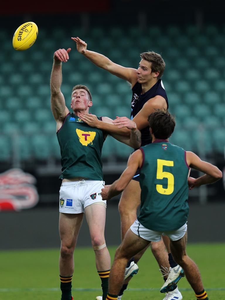 Vic Metro William Clarke and Tasmania Samuel Siggins during the game at UTAS Stadium. PICTURE CHRIS KIDD