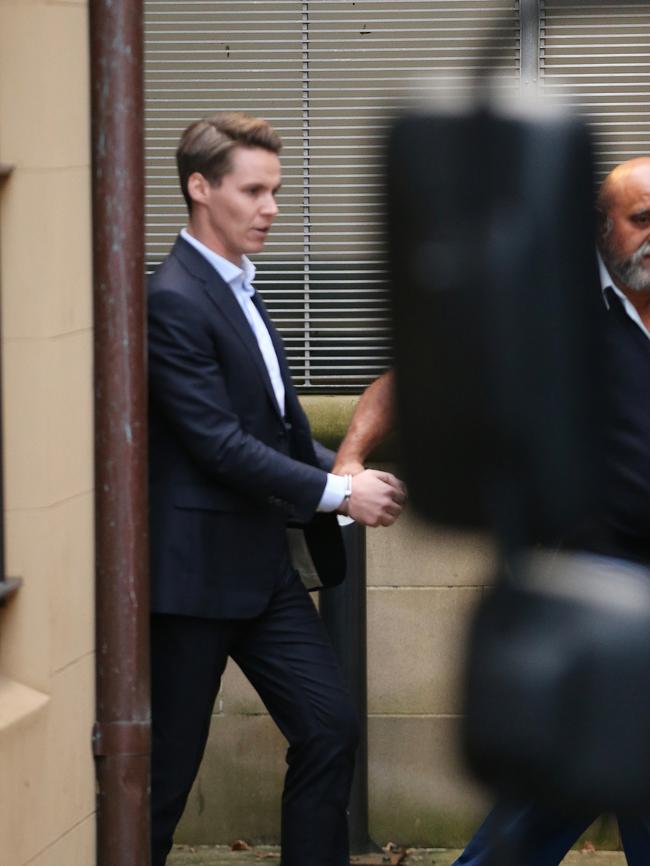 Oliver Curtis being transported to prison after being sentenced. Picture: Craig Greenhill