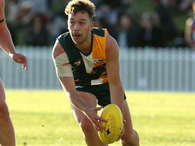 NFL footy: Northcote Park v North Heidelberg: Lachlan King of Northcote Park runs forward on Saturday, April 17, 2021 in Northcote, Australia