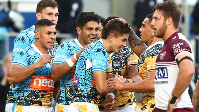 Jayden Campbell celebrates his maiden NRL try. (Photo by Chris Hyde/Getty Images)