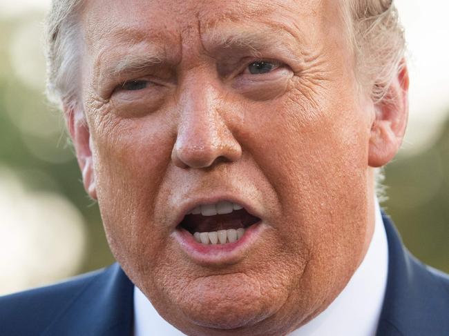 US President Donald Trump speaks to the press as he departs the White House in Washington, DC, on September 22, 2020. - President Trump travels to Pittsburgh, Pennsylvania, for a campaign rally. (Photo by SAUL LOEB / AFP)