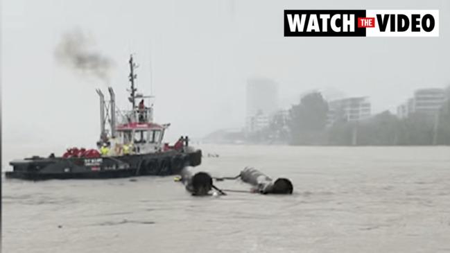 Man clings to overturned houseboat