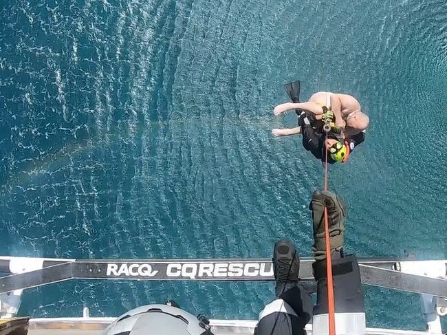 Two men are rescued from the waters off the Queensland coast. Picture: Supplied / RACQ CQ Rescue