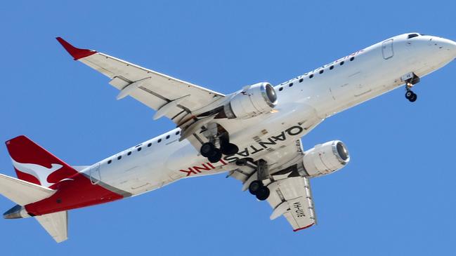 BRISBANE, AUSTRALIA - NewsWire Photos SEPTEMBER 30, 2024: A Qantas plane prepares to land in Brisbane. Hundreds of Qantas workers went on strike today demanding higher wages. Picture: NewsWire/Tertius Pickard