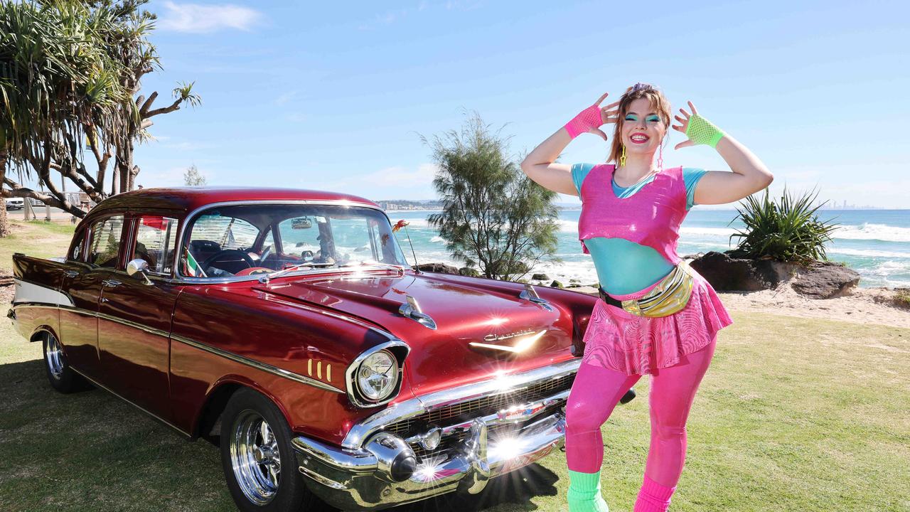 Australia’s largest nostalgia festival, Cooly Rocks On, which traditionally covered the music, lifestyle and cars from the 1950s, 60s and 70s, is this year unveiling a brand new precinct, covering all things 80s. Miss Roxanne La Roller bringing a different look to a classic Chevrolet at Coolangatta. Picture: Glenn Hampson.
