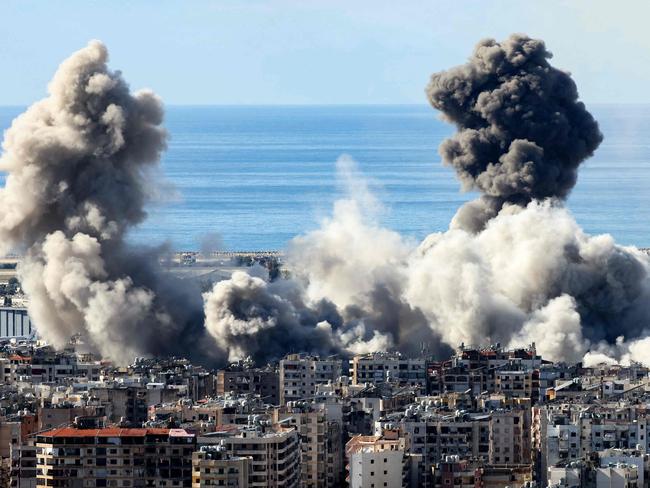 TOPSHOT - Smoke rises from the site of an Israeli airstrike that targeted Beirutâs southern suburbs on November 26, 2024, amid the ongoing war between Israel and Hezbollah. Israel's security cabinet was due to meet on November 26 to vote on a proposed ceasefire in its war with Hezbollah in Lebanon, an official said, while the White House voiced optimism that a deal was close. (Photo by IBRAHIM AMRO / AFP)