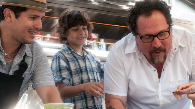 John Leguizamo, Emjay Anthony and Jon Favreau in a scene from Chef.