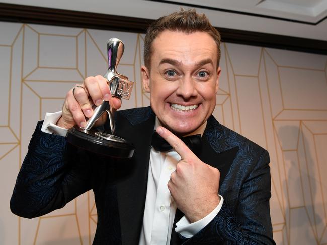 Grant Denyer poses with his Logie award. Picture: AAP