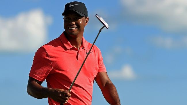 Tiger Woods was all smiles after his return to competitive golf in December. Photo: Mike Ehrmann