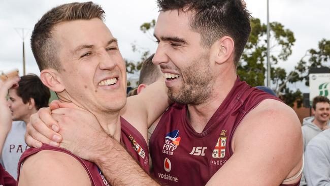 Jack Trengove and Cameron Giles celebrate after winning the Adelaide Footy League division one grand final last season. Picture: Brenton Edwards